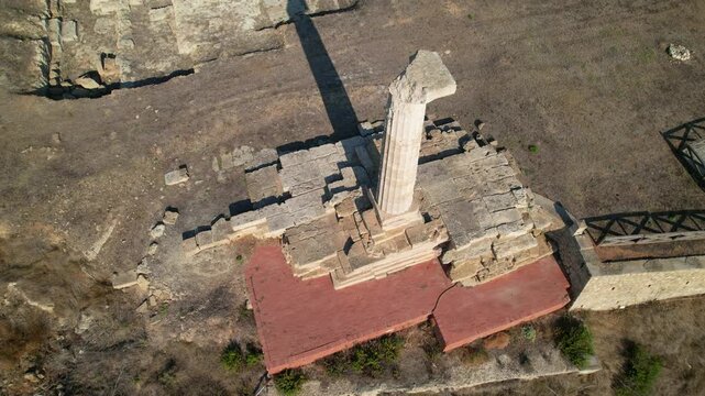 Archaeological area of ​​Capo Colonna. The last column of the Temple of Hera Lacinia remains erected. Italy Crotone 01.08.2024. drone video