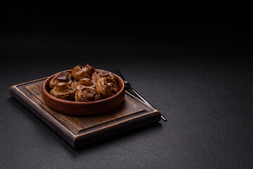Delicious juicy whole champignons baked on the grill with salt and spices