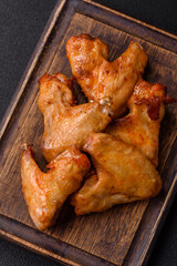 Delicious fried chicken wings with salt, spices and herbs