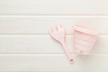 Cute toys for playing with sand on wooden background, top view © Liami