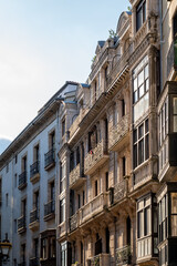 office building with sky and football flags in the windows in Bilbao