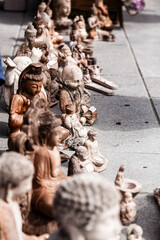  Statuettes of the Buddha for sale on the street at Kingston, Ontario, Canada