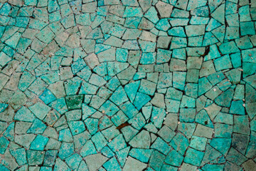 An Intricate Mosaic Pattern Composed of Elegant Teal and Gray Tiles Creates a Unique Visual