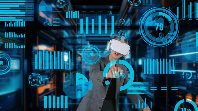 Businesswoman explaining dynamic market data calculated analysis in big data business by VR innovation interface digital infographic network technology visual hologram animation server. Contraption.