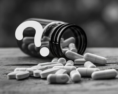 Wrong Medication. Monochromatic Background with Questionable Pills in Pharmaceutical Container