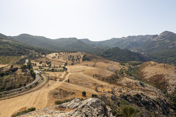 Panoramic View of Rolling Hills and Mountains