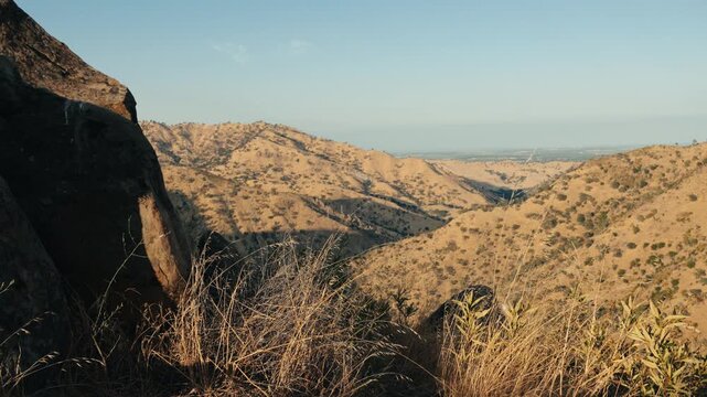 Dry grass next to rocks on mountain top near Winters california
