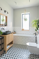 Modern bathroom interior with pattern tiles on the floor in industrial design and stylish decor. Vertical.