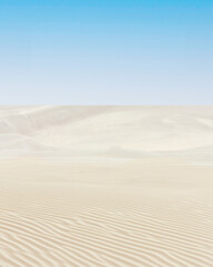 Large Desert Sand Dunes With Ripples And A Beautiful Blue Sky In Background