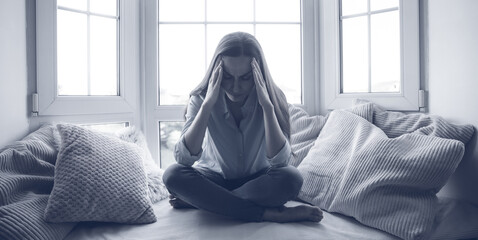 Sad, depressed, frustrated, angry, lonely, emotional young woman with severe stress and mental...