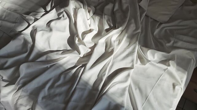 Rumpled blanket on the bed in the morning
