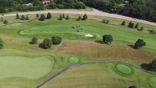 Aerial view over golf club in summertime, sunlight
