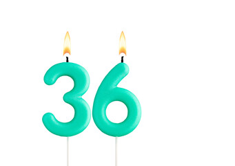 Green birthday candle on white background - Candle number 36