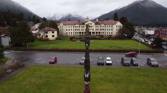 Aerial view of Sitka, Alaska totem poll and historic building, cinematic drone video  
