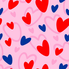 Vector seamless pattern with red and blue hearts on pink background