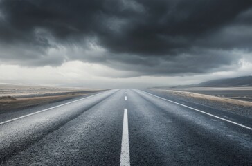 Naklejka premium Dramatic Sky Over Lonely Asphalt Road Stretching Into the Distance