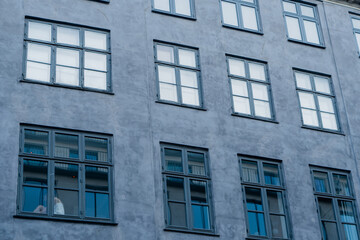 Fototapeta premium Architecture. Gray building with large windows.