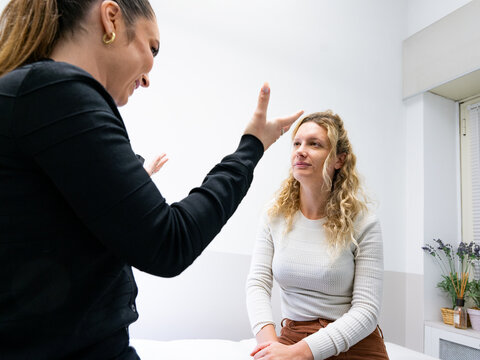 Beautician Explaining Microblading Treatment to Client