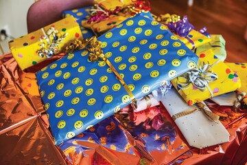Close-up view of birthday-wrapped children's gifts arranged on a table.