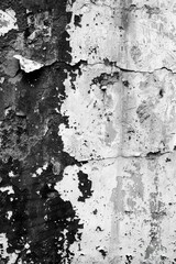 Fototapeta premium A close-up shot of peeling paint on a wall, with cracks and flakes visible