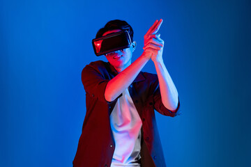 Smart gamer wearing VR turning to metaverse world playing gun shooting hunter isolated blue neon light connected to victory animal hunting futuristic technology hologram virtual reality. Contrivance.