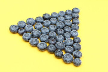 Fresh blueberry on yellow background	