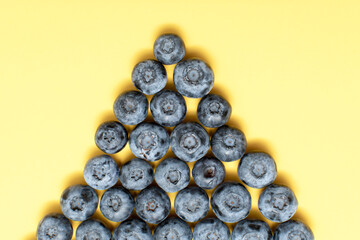 Fresh blueberry on yellow background	