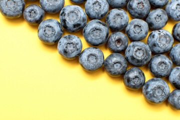 Fresh blueberry on yellow background	