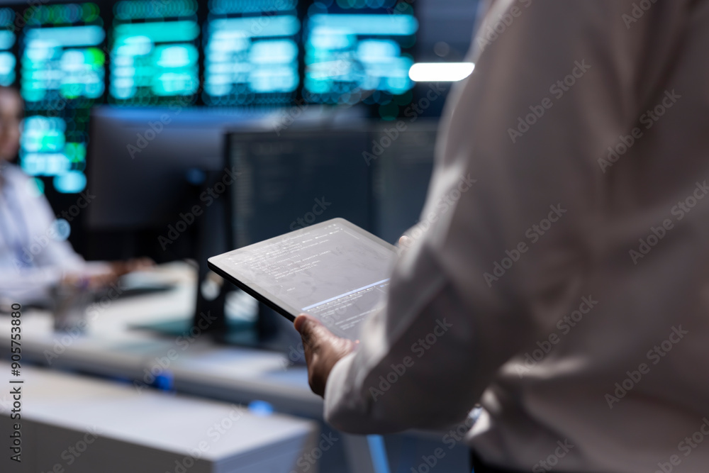Poster admin doing yearly checkup to prolong data center electronics life span and avoid downtime. employee
