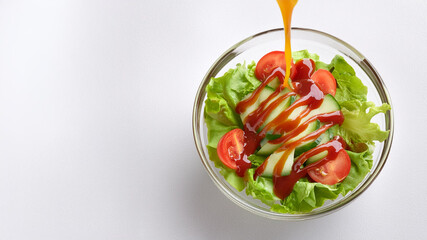 A glass blow of green salad on a white background with sauce dripping, ai generated