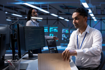 Data center professional developing emergency procedures to ensure company continuity in case of...