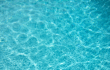 Surface of pool water. Blue sea water background texture. Water with ripples. Water waves pattern texture background. Abstract banner background.