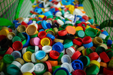 Plastic lids. Colored plastic caps. Recycling of plastic. Selective focus
