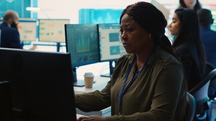 Naklejka premium Enterprise manager analyzes annual reports and statistics on a pc, works on creating business strategies and goals. Analyst studying market dynamics and organizational progress. Camera A.