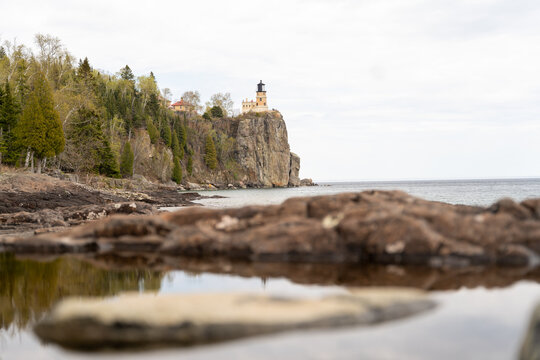 A beautiful view of Split Rock Lighthouse on the rocky coast of Lake Superior.