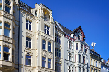 beautiful pastel-colored old buildings with historicist and art nouveau elements in the belgian quarter of cologne