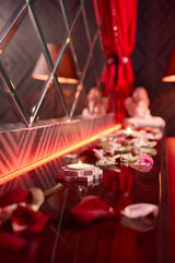 A beautiful Romantic Candlelit Setting adorned with Flowers and Grapes for special moments