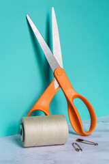 Scissors, thread, and safety pins for crafts and embroidery
