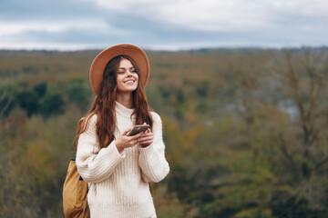 Mountain Woman's Adventurous Selfie: Embracing Freedom and Nature with Cyberspace Communication