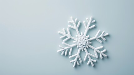 Beautifully detailed and symmetrical snowflake, isolated on a clean background, with plenty of space for marketing text or logos