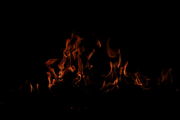 Texture of fire on black background. Hell bonfire. Texture of fire on a black background. Fire over...