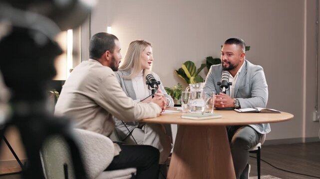 Interview, microphone and podcast with influencer people in recording studio for live radio broadcast. Discussion, media and news with talk show team streaming subscription service on air platform