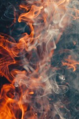Fototapeta premium Fiery flame with smoke emitting from the top, great for use in scenarios involving heat or warmth