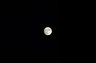 Full moon on dark sky background