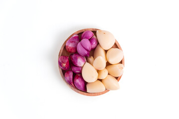 red onion and garlic in wooden container isolated on white background. Perfect for recipes, articles or any cooking content.