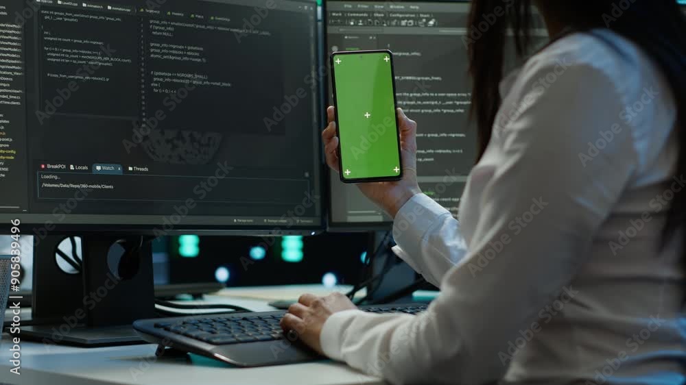 Poster worker overseeing data center using green screen mobile phone, ensuring system can handle networking