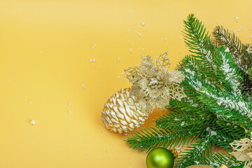 Traditional New Year composition. Festive decor, snowy Christmas tree branches, balls, flowers