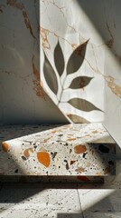Elegant leaf shadow on a terrazzo stone display podium