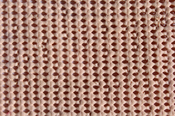 Peach pink rubber foam with holes textured abstract background