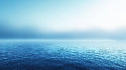 Fototapeta premium Serene Ocean Mist: A breathtaking minimalist landscape photograph captures the essence of tranquility. The vast expanse of the ocean, shrouded in ethereal mist, evokes a sense of peace and serenity. 